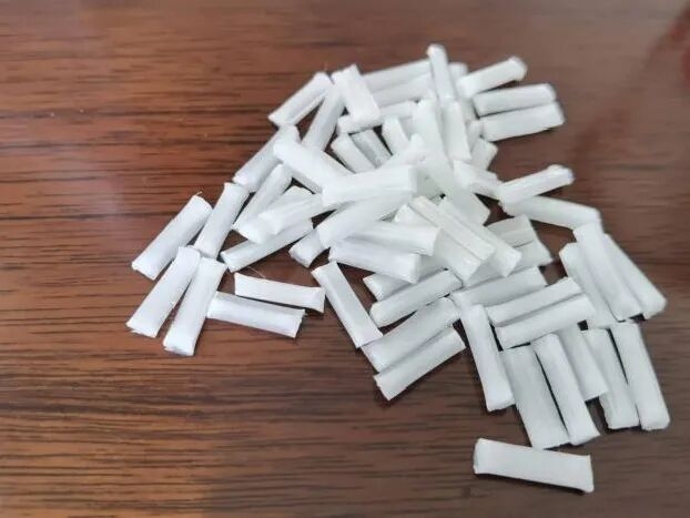 Shipping containers at a major port representing trade logistics for plastic extrusion products