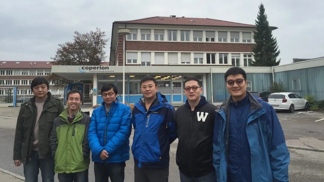 International shipping containers at a major port representing trade logistics for thermoplastic extrusion products