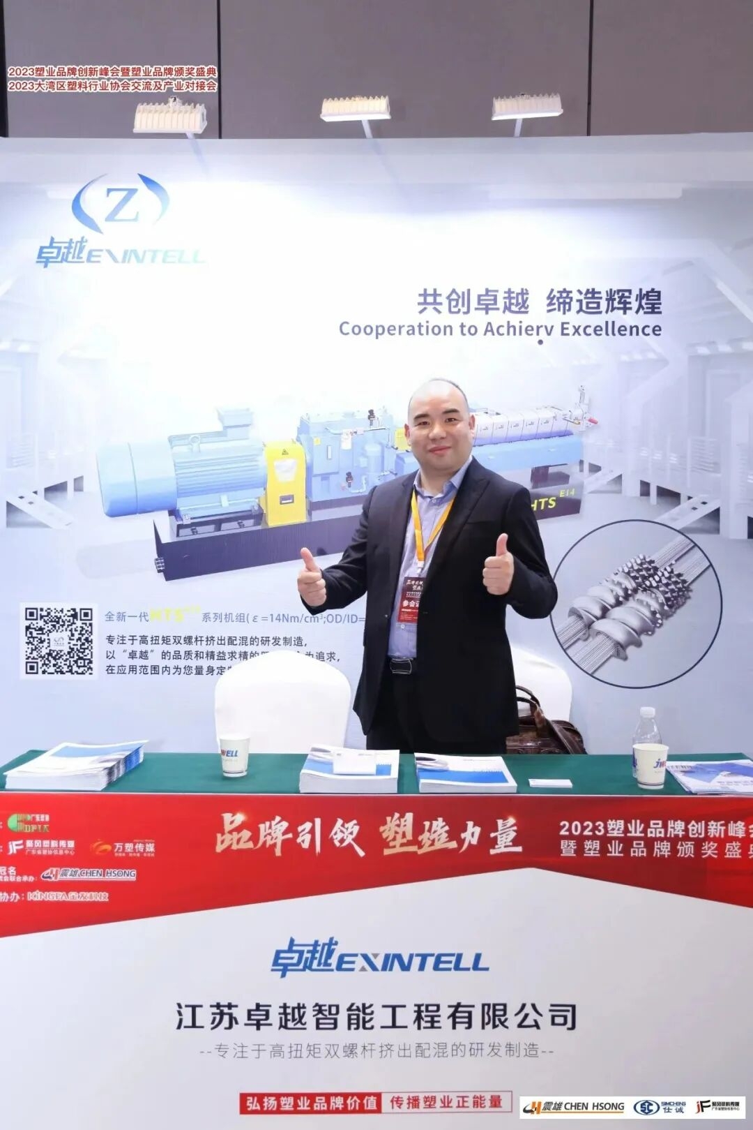 Engineer inspecting industrial machinery in a factory setting representing quality control in masterbatch machine manufacturi