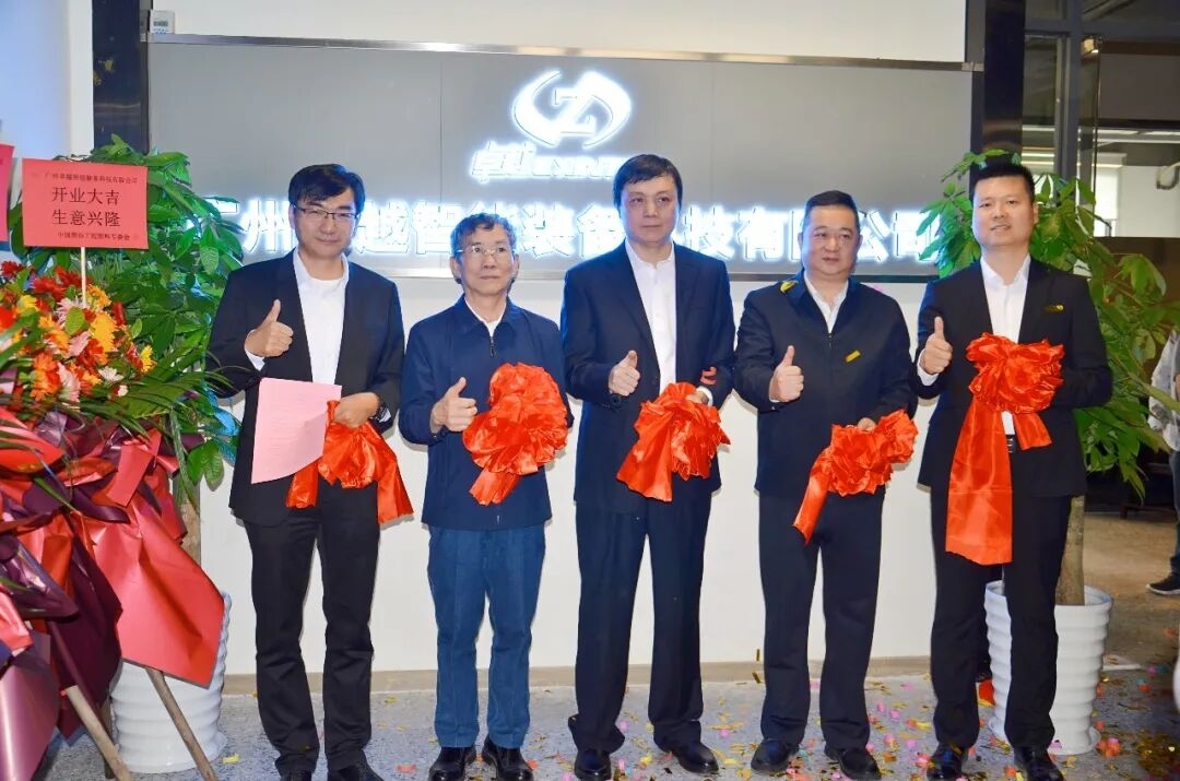 International B2B trade exhibition hall with industrial machinery displays and business professionals networking