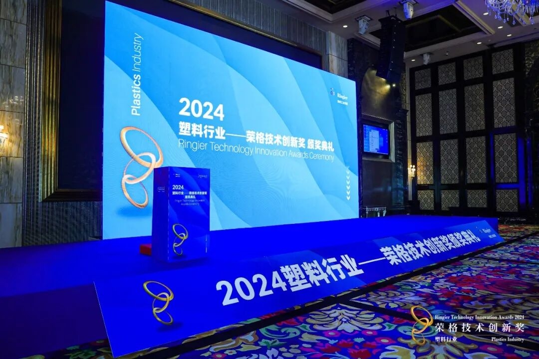 Industrial plastic extrusion machinery in a modern manufacturing facility producing filler masterbatch pellets