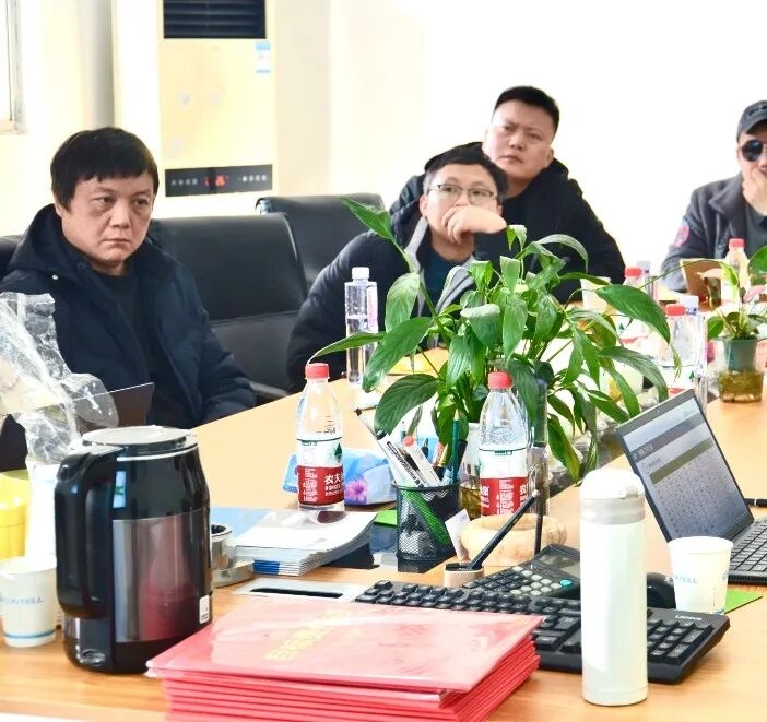 Business professionals in a modern office reviewing B2B trade documents and industrial equipment specifications