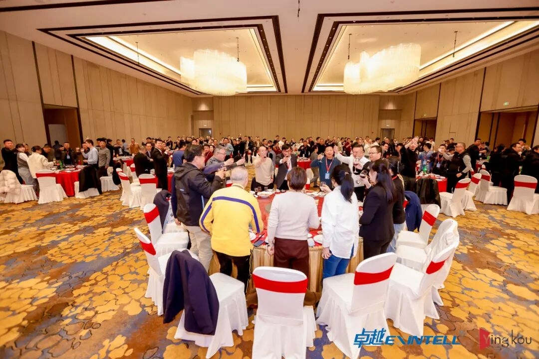 Business professionals reviewing industrial equipment specifications at a B2B trade exhibition