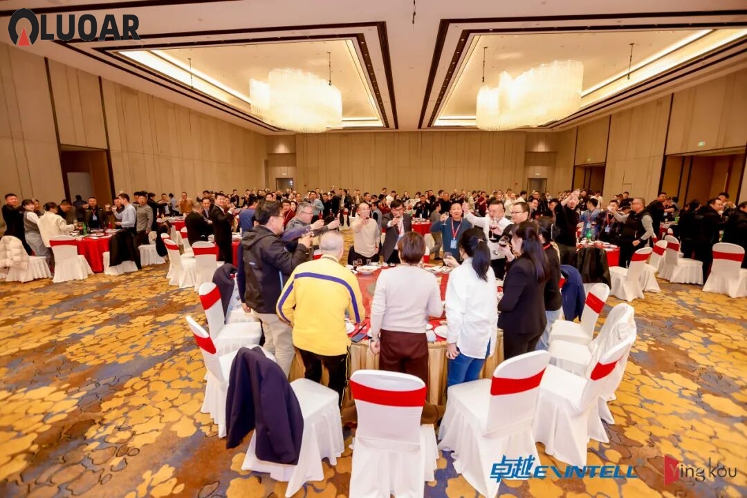 Business professionals reviewing industrial equipment specifications at a B2B trade exhibition