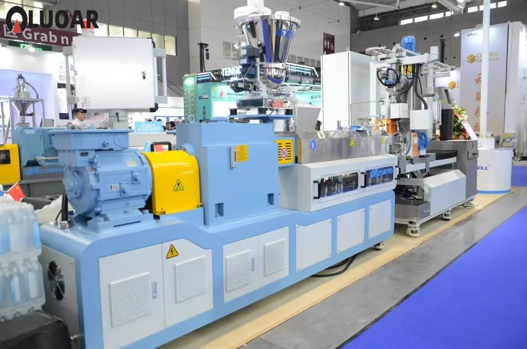 Industrial manufacturing facility with heavy machinery representing twin screw extrusion line production environment