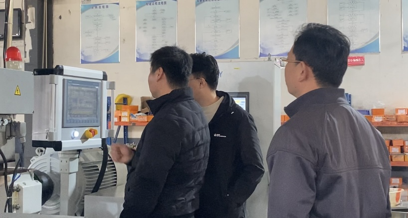 Business professionals reviewing trade documents and financial data representing B2B procurement negotiations for industrial